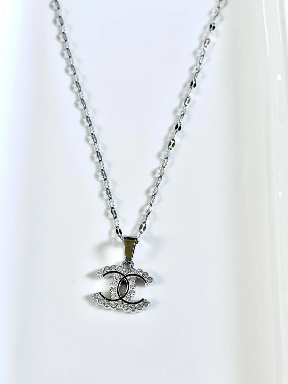 Crystal-Embellished Interlocking Logo Pendant Necklace in Silver